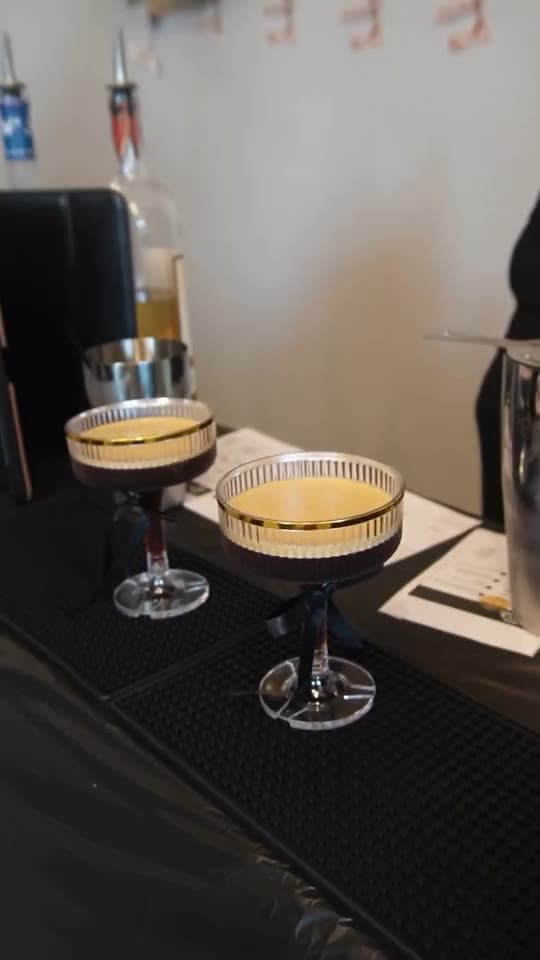 Two espresso martinis ready to be served at a Piper's Pour event