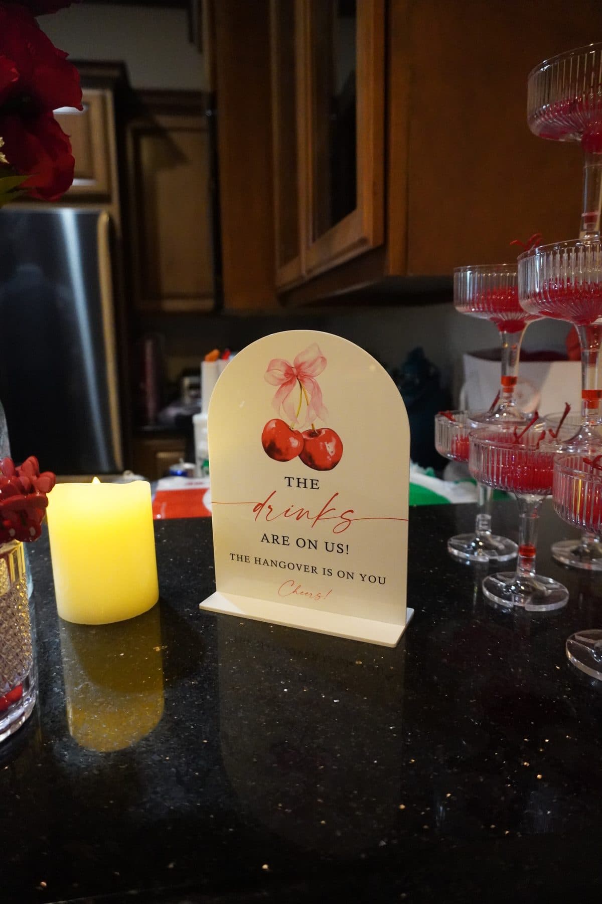 Styled cherry cocktail tablescape with candlelight at a Piper's Pour event